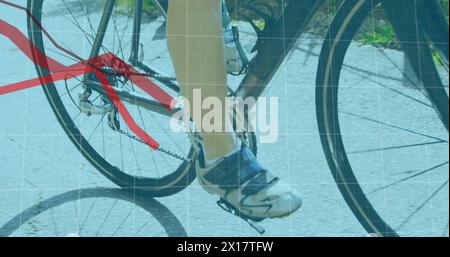 Image of red lines and statistics recording over low section of woman cycling on the road in the bac Stock Photo