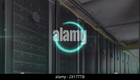 Image of illuminated loading circle over white dots against server room Stock Photo