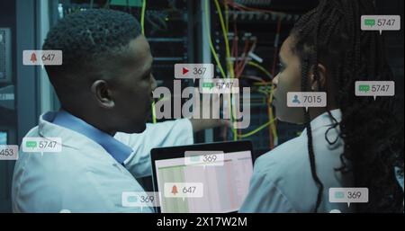 Image of notification bars over african american engineers discussing about data server system Stock Photo