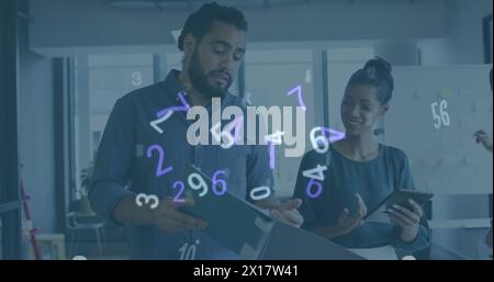 Image of numeric data processing over diverse creative business colleagues using tablet talking Stock Photo