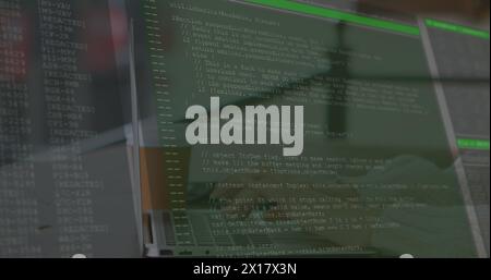 Image of data processing over hands using laptop Stock Photo