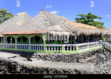 Lake Managua, Leon, Nicaragua, Central America, Central America, Traditional beach hut with palm roof and colourful facade Stock Photo