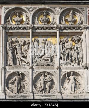 One of the two stone relief decorative panels by the main entrance of Amsterdam Central Station, Netherlands Stock Photo