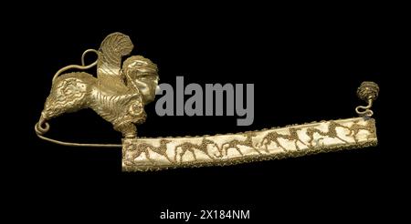 Etruscan gold fibula (metal brooch) from Tomb of Lictor.  Italy Stock Photo