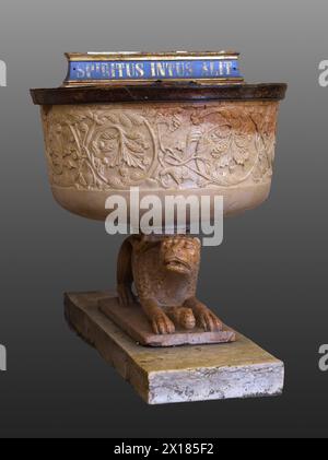 The Baptismal font in Baptistery of Parma (Battistero di Parma).  'Spiritus intus alit' -  latin phrase (from Virgil) meaning the spirit nourishes wit Stock Photo