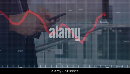 Image of financial data processing over person using smartphone Stock Photo