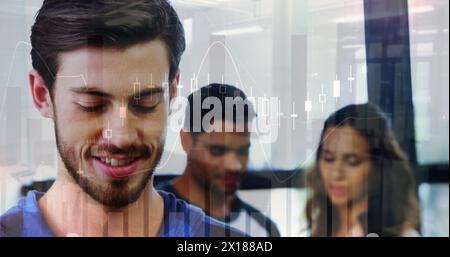 Image of financial graphs over caucasian businessman in office Stock Photo