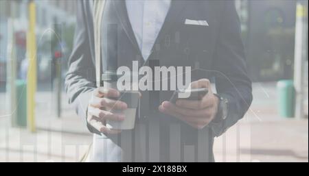 Image of financial graphs over midsection of caucasian businessman using smartphone Stock Photo