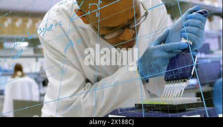 Image of mathematical equations over caucasian male scientist in lab Stock Photo