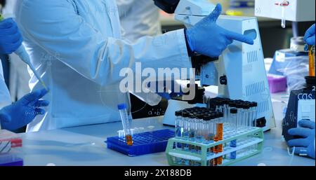 Image of mathematical equations over group of scientists in lab Stock Photo