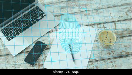 Image of fingerprint scanner over laptop, coffee cup, paper blank, smartphone on wooden surface Stock Photo