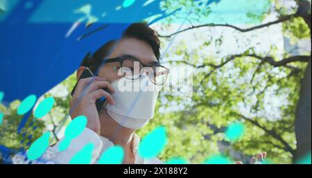 Image of data processing over asian man using smartphone Stock Photo