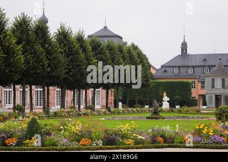 Mixed flower borders, topiary trees and water fountain in the Schwetzingen palace garden in late summer, Schwetzingen, Germany Stock Photo