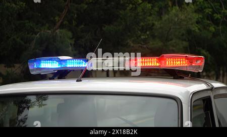 Police car flashing lights, closeup of photo with shallow depth of field Stock Photo
