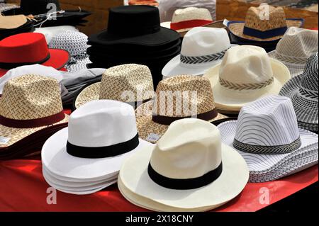 Seville, A selection of different hats displayed on a market stall, Seville, Andalusia, Spain Stock Photo