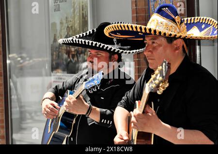 Seville, Two musicians in traditional Mexican sombreros playing guitar, Seville, Andalusia, Southern Spain, Spain Stock Photo