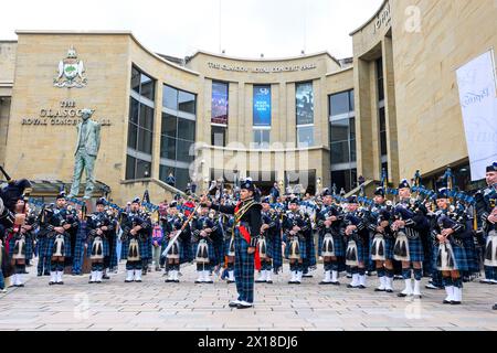 Pipers and drummers from the Royal Edinburgh Military Tattoo perform in Buchanan Street, Glasgow, during the Piping Live festival, Glasgow, Scotland, UK Stock Photo
