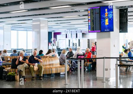 Passengers in the departure lounge at Edinburgh Airport, Edinburgh, Scotland, UK Stock Photo