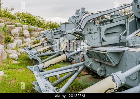 Rear view of military tanks in camouflage paint on display in public ...