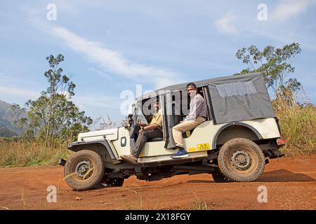 Guides in a jeep of the Red Earth National Park, Periyar Wildlife Sanctuary or Periyar National Park, Idukki District, Kerala, India Stock Photo