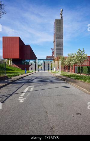 Entrance to the Nordstern industrial park with Fritz-Schupp-Strasse, winding tower of the former Nordstern colliery and Hercules statue in Stock Photo