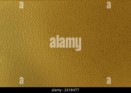 Foil surface. Abstract background from a gilded surface. Stock Photo