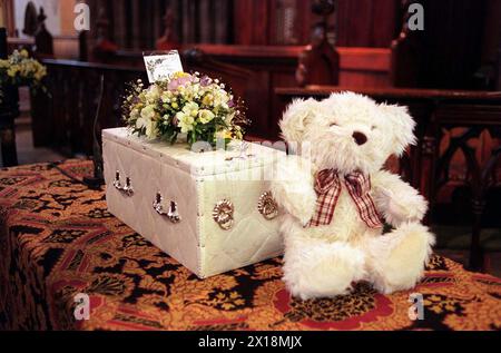 File photo dated 27/07/98 of the coffin bearing the body of abandoned baby Callum who was discovered close to the Gulliver's World theme park in the Callands area of the town in March 1998 and a murder investigation was launched. Joanne Sharkey, 54, of West Derby in Liverpool, has been charged with murder by detectives investigating the death of a baby found in woodland in Warrington more than 25 years ago. The 54-year-old will appear in custody at Warrington Magistrates' Court on Tuesday, charged over the death. Issue date: Monday April 15, 2024. Stock Photo