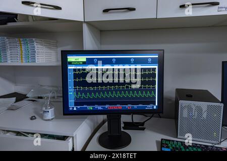 Denizli, Turkey - 28 February 2024; Monitor screen with vital sign and ECG data of patient during surgery inside operating room in hospital. Showing p Stock Photo