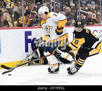 Pittsburgh, United States. 15th Apr, 2024. Pittsburgh Penguins left wing Michael Bunting (8) chases Nashville Predators right wing Luke Evangelista (77) behind the net during the third of the Penguins 4-2 win at PPG Paints Arena in Pittsburgh on Monday, April 15, 2024. Photo by Archie Carpenter/UPI. Credit: UPI/Alamy Live News Stock Photo