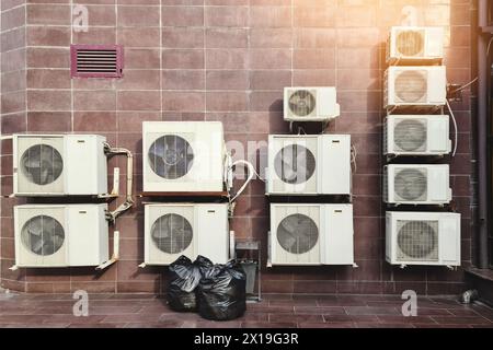 Air conditioner compressor outdoor units installed outside the building ...