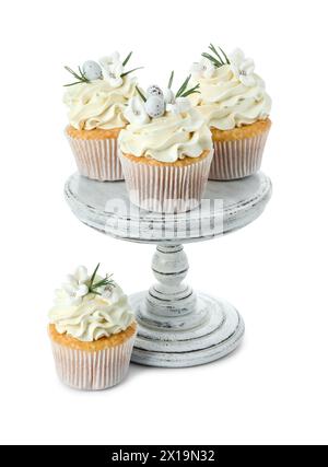 Tasty Easter cupcakes with vanilla cream isolated on white Stock Photo