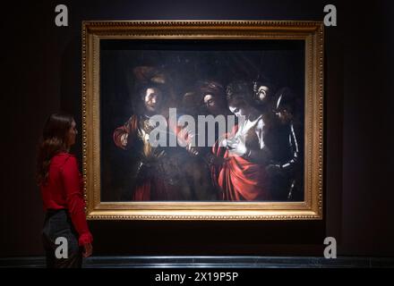The National Gallery, London, UK. 16th April, 2024. The National Gallery displays Caravaggio's (Michelangelo Merisi da Caravaggio (1571-1610)) last painting, not seen in the UK for nearly 20 years. The Martyrdom of Saint Ursula, 1610, generously lent by the Intesa Sanpaolo Collection (Gallerie d'Italia - Naples) is displayed alongside another late work by the Italian artist from the National Gallery Collection, Salome receives the Head of John the Baptist, about 1609-10. The exhibition runs from 18 April - 21 July 2024. Credit: Malcolm Park/Alamy Live News Stock Photo
