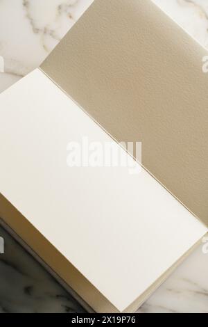 blank pages in handmade book on white marble table Stock Photo