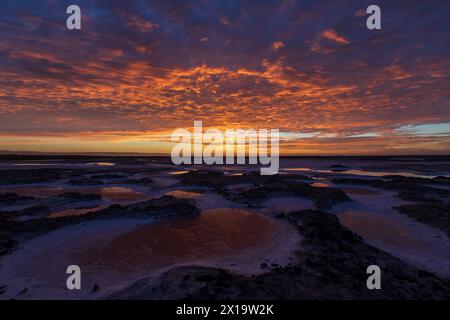 Dramatic Sunset of Dried Salt Ponds. Alviso Marina County Park, Santa Clara County, California, USA. Stock Photo