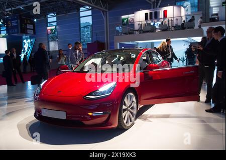 File photo - Tesla new Model 3 during the Paris Motor Show 2018, known as Mondial de l'Automobile held at the Porte de Versailles exhibition centre in Paris, France on October 2, 2018. Tesla will lay off more than 10% of its global workforce, according to a memo sent to employees by CEO Elon Musk. The company's shares closed down more than 5% on Monday. Tesla had 140,473 employees as of December 2023. Tesla shares have taken a bruising in recent months, falling 31% year to date. While electric vehicle sales are still gaining popularity worldwide, their sales growth rate has slowed especially f Stock Photo