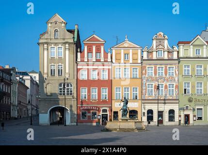 The colorful facades of the historic old town of Poznan are richly decorated and glow in the morning sun. All the gables are playfully different. Stock Photo