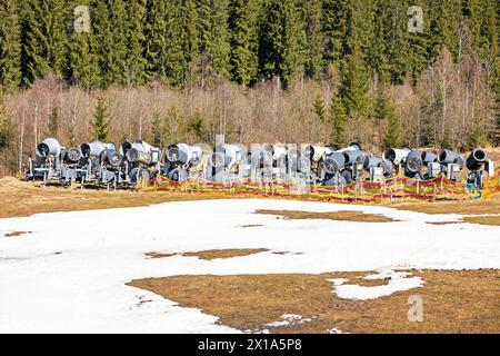 non-working snow generator on a slope without snow gear at a resort on a sunny day. Active recreation Stock Photo