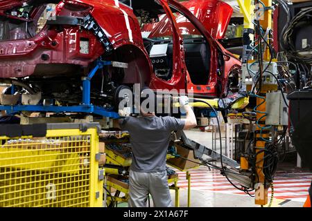 Industrial production of cars automobiles. Plant for assembling modern cars on an assembly line. Industry, production, industry concept. High quality photo Stock Photo
