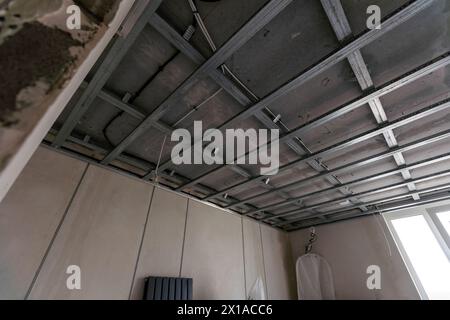 Electrical wiring in a protective corrugation. Installation and wiring of electrical networks in an apartment or house. Close-up Stock Photo