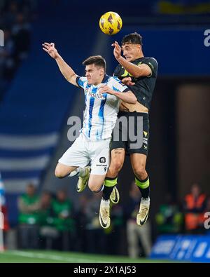 Marc Pubill of UD Almeria compete for the ball with Ander Barrenetxea of Real Sociedad during the LaLiga EA Sports match between Real Sociedad and UD Stock Photo