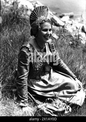 Traditional costume - Wachau, woman in Wachau traditional costume with, traditional costume - Wachau, woman in Wachau traditional costume with gold hood, in a meadow sitting, laugh, 1948 - 19480101 PD1054 - Rechteinfo: Rights Managed (RM) Stock Photo