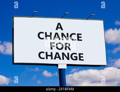 A chance for change symbol. Concept words A chance for change on beautiful big white billboard. Beautiful blue sky cloud background. Business A chance Stock Photo