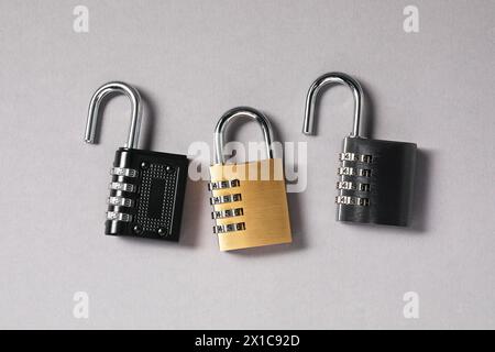 Steel combination padlocks on grey background, top view Stock Photo