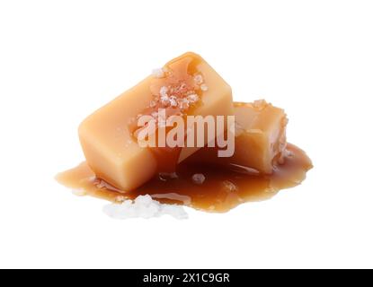 Yummy caramel candies and sea salt isolated on white Stock Photo