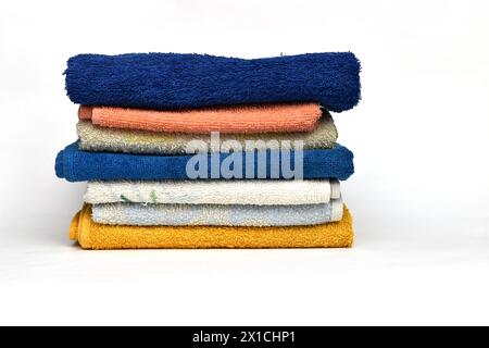 On a white background, terry towels used in the kitchen for hands, which lie in a pile, are removed. Stock Photo