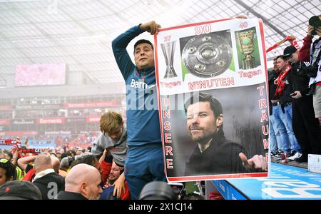Bundesliga, BayArena Leverkusen; Bayer Leverkusen vs SV Werder Bremen; Bayer fan with poster for the triple. Stock Photo