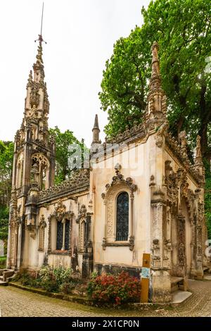 Capela da Santissima Trindade, An ornate chapel with an impressive, neo-gothic tower. Quinta da Regaleira park, Sintra, Portugal Stock Photo