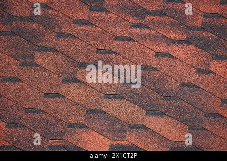 Red hexagonal flexible shingles, modern roof pattern, background photo texture Stock Photo