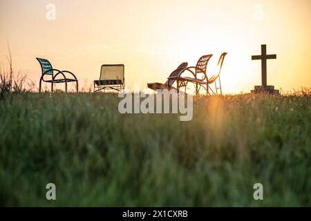 Cross and chairs on a knoll at the Abbey of Gethsemani near Bardstown, Kentucky, USA Stock Photo