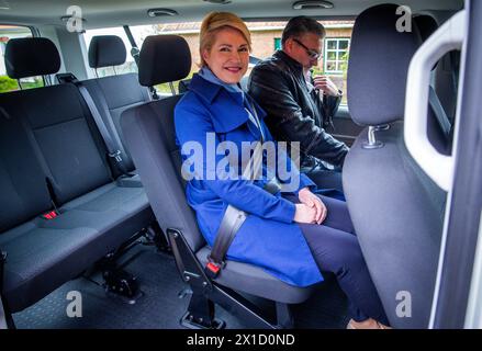 16 April 2024, Mecklenburg-Western Pomerania, Wakenstädt: Manuela Schwesig (SPD), Minister President of Mecklenburg-Vorpommern, sits on a call bus operated by local transport company Nahbus. The on-call bus system in Mecklenburg-Vorpommern is to be expanded nationwide over the next few years, with Schwesig (SPD) and Economics Minister Meyer (SPD) giving the official go-ahead. The district of Nordwestmecklenburg has been offering an on-demand bus network with 33 routes since 01.03.2024. Photo: Jens Büttner/dpa Stock Photo